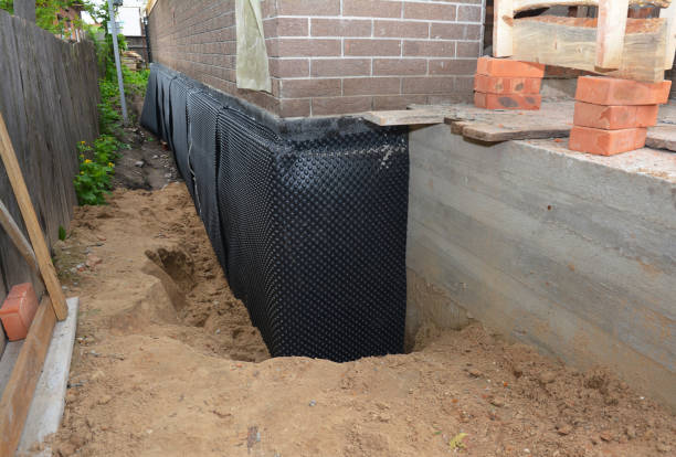 SJ Waterproofing Pros technician performing targeted Interior Drainage System assessment in Pierceton, IN